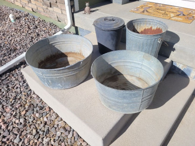 Small metal tubs and trash cans